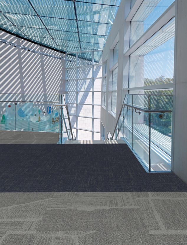 Open Air carpet tile in airport open plan with window ceilings